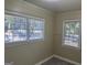 Cozy carpeted bedroom with natural light from two windows with blinds at 718 N Hairston Rd, Stone Mountain, GA 30083