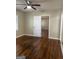 This bedroom features hardwood floors, neutral paint and ceiling fan at 718 N Hairston Rd, Stone Mountain, GA 30083