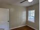 Comfortable bedroom with hardwood flooring, neutral walls, and a bright window at 718 N Hairston Rd, Stone Mountain, GA 30083