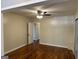 This bedroom features hardwood floors, a ceiling fan, and neutral paint at 718 N Hairston Rd, Stone Mountain, GA 30083