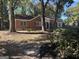 Traditional brick home featuring mature trees, a manicured lawn, and charming curb appeal at 718 N Hairston Rd, Stone Mountain, GA 30083