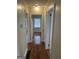 Hallway displaying hardwood floors and neutral paint at 718 N Hairston Rd, Stone Mountain, GA 30083