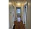 Hallway displaying hardwood floors and neutral paint at 718 N Hairston Rd, Stone Mountain, GA 30083