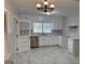 Bright kitchen featuring white cabinets, modern appliances, and granite countertops at 718 N Hairston Rd, Stone Mountain, GA 30083