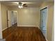 Large living room with hardwood floors, ceiling fan, and sliding glass doors at 718 N Hairston Rd, Stone Mountain, GA 30083