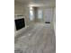 Spacious living room featuring plush new carpet and a charming fireplace at 718 N Hairston Rd, Stone Mountain, GA 30083