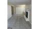 Spacious living room featuring a fireplace, neutral carpet, and ample storage at 718 N Hairston Rd, Stone Mountain, GA 30083