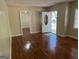 Open living room featuring pristine hardwood floors and a neutral color palette ready for personal touches at 718 N Hairston Rd, Stone Mountain, GA 30083