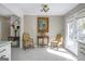 Bright dining area with white cabinets, french doors and a painting of flowers at 4247 Windward Ln, Norcross, GA 30093