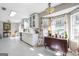 Large, bright kitchen features stainless appliances, white cabinets, and a dining nook with windows at 4247 Windward Ln, Norcross, GA 30093
