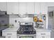 Well-equipped kitchen with stainless steel appliances, white subway tile backsplash and stylish decor at 4247 Windward Ln, Norcross, GA 30093