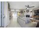 Spacious living room featuring modern decor, a ceiling fan, and a striking white stone fireplace at 4247 Windward Ln, Norcross, GA 30093