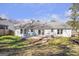 Exterior view of home with a well-maintained backyard and spacious wooden deck at 4247 Windward Ln, Norcross, GA 30093