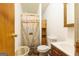 Functional bathroom features wood-look shower doors and practical layout at 105 Woodfield Rd, Covington, GA 30014