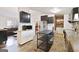 Bright kitchen with dark cabinets, stainless steel appliances, and an open design flowing into the living room at 105 Woodfield Rd, Covington, GA 30014