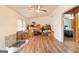 Spacious living area with natural light, ceiling fan and wood-look flooring at 105 Woodfield Rd, Covington, GA 30014