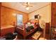 Wood-paneled main bedroom with natural light and TV at 105 Woodfield Rd, Covington, GA 30014