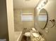 Updated bathroom featuring stylish granite countertop, modern fixtures, and tiled walls at 3395 Longleaf Dr, Decatur, GA 30032