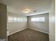 Neutral bedroom featuring carpet floors, two large windows, and soft, neutral colored walls at 3395 Longleaf Dr, Decatur, GA 30032