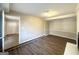 Cozy living room featuring new vinyl floors, a fireplace, and an open doorway leading to other rooms at 3395 Longleaf Dr, Decatur, GA 30032
