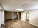 Spacious carpeted basement featuring a drop ceiling, neutral walls, and an open doorway at 3558 Turner Heights Dr, Decatur, GA 30032