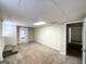 Finished basement featuring an open doorway, carpet, and a drop ceiling at 3558 Turner Heights Dr, Decatur, GA 30032