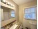 Updated bathroom featuring granite countertop and a tub and shower at 3558 Turner Heights Dr, Decatur, GA 30032