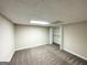 Bedroom in basement featuring closet, neutral carpet, and bright walls at 3558 Turner Heights Dr, Decatur, GA 30032