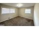 Bedroom featuring multiple windows with blinds, neutral walls, and neutral carpet at 3558 Turner Heights Dr, Decatur, GA 30032