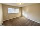 Neutral bedroom featuring a window with blinds and neutral walls and carpet at 3558 Turner Heights Dr, Decatur, GA 30032