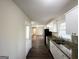 This kitchen has granite countertops, stainless appliances, and modern white cabinetry at 3558 Turner Heights Dr, Decatur, GA 30032