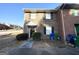 Two-story brick townhome featuring a covered entrance, manicured shrubs and nearby sidewalks at 4517 Golf Vista Cir, Decatur, GA 30035