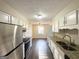 Kitchen with stainless steel appliances, granite countertops and abundant white cabinetry at 4517 Golf Vista Cir, Decatur, GA 30035