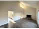 Spacious living room featuring vaulted ceilings, wood-look flooring and a brick fireplace at 4517 Golf Vista Cir, Decatur, GA 30035