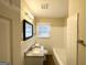 Clean and updated bathroom with a granite vanity, and tiled shower-tub at 2000 Marvin Sw Ln, Atlanta, GA 30311