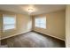 Comfortable bedroom with two bright windows and neutral carpeting at 2000 Marvin Sw Ln, Atlanta, GA 30311
