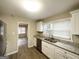 Bright and updated kitchen features granite countertops, and stainless steel dishwasher and sink at 2000 Marvin Sw Ln, Atlanta, GA 30311