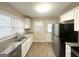 Updated kitchen featuring granite countertops, stainless steel appliances, and ample cabinet space at 2000 Marvin Sw Ln, Atlanta, GA 30311