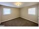 Clean and bright bedroom with two windows providing ample light and plush carpeting at 2191 Tilson Cir, Decatur, GA 30032