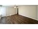 Bright, freshly painted living room featuring modern laminate flooring and new ceiling fan for a comfortable ambiance at 2191 Tilson Cir, Decatur, GA 30032