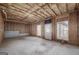 Unfinished basement with exposed ceiling insulation, the frame, and the door to the outside at 253 Summit View Dr, Mcdonough, GA 30253
