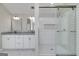 Bathroom featuring a double vanity, granite countertops, and a glass-enclosed shower with white tile, creating a modern and clean space at 253 Summit View Dr, Mcdonough, GA 30253