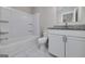 Bathroom with a shower and tub combination, toilet, granite countertop, and white vanity, creating a practical and stylish space at 253 Summit View Dr, Mcdonough, GA 30253
