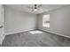 Neutral bedroom featuring gray carpet and a window, providing a serene retreat at 253 Summit View Dr, Mcdonough, GA 30253