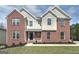 Two-story brick and siding home with a black front door and manicured lawn at 253 Summit View Dr, Mcdonough, GA 30253