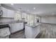 Bright kitchen features white cabinets, stainless steel appliances, granite counters, and an open layout at 253 Summit View Dr, Mcdonough, GA 30253