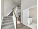 Carpeted staircase leading to the second floor, with view of living area at 253 Summit View Dr, Mcdonough, GA 30253