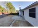 Backyard featuring a stone paver patio, sitting area, landscaped garden, and privacy fence at 4030 Cresent Walk Ne Ln, Suwanee, GA 30024