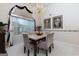 Elegant dining room featuring a marble table, soft lighting, and large window at 4030 Cresent Walk Ne Ln, Suwanee, GA 30024