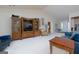 Bright living area with entertainment center, large windows and comfortable seating at 4030 Cresent Walk Ne Ln, Suwanee, GA 30024